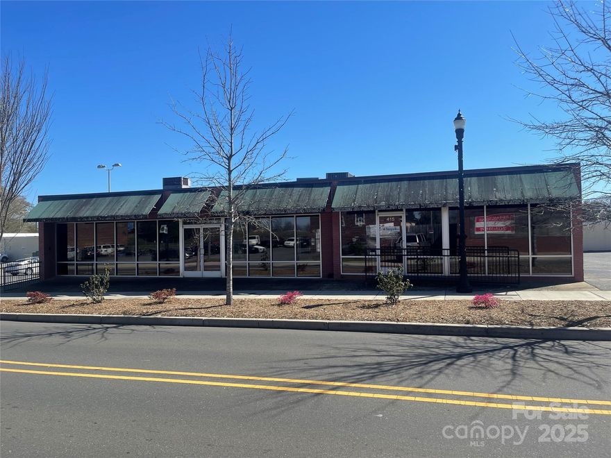 Prime Retail Opportunity in Historic Downtown Gastonia

Located in the heart of Gastonia’s thriving Central Business District, 413 W. Main Ave offers an exceptional opportunity for investors or business owners seeking prime retail space. This expansive property features over 6,000 square feet of versatile commercial space, currently divided into four retail bays, providing excellent income potential.
Situated on approximately 0.51 acres, this property enjoys high visibility and foot traffic, positioned just blocks away from the renowned Gastonia Ghost Pepper Stadium. As part of a designated social district, this location benefits from increased customer engagement and business activity.
Whether you’re looking to establish a new venture, expand an existing business, or invest in one of Gastonia’s fastest-growing areas, 413 W. Main Ave presents an unmatched commercial opportunity.