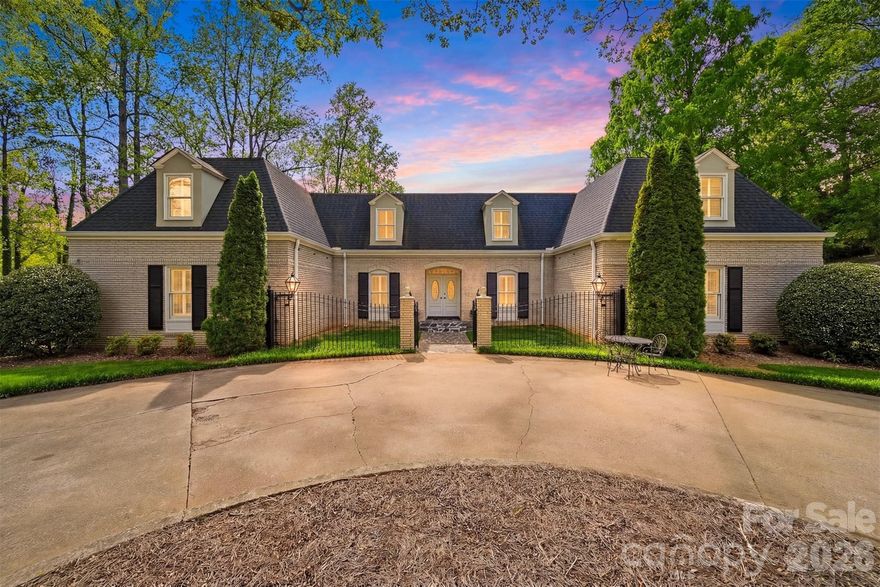 Location, lifestyle and luxury! This immaculate home is nestled in the highly desirable Lake Hickory Country Club/Shuford area and has been extensively remodeled since 2019, including updates to the kitchen, 3.5 bathrooms, roof, gutters, HVAC, and basement. The spacious gourmet kitchen features abundant cabinetry, a large island with beautiful lighting, a breakfast area, and a cozy sitting area with a wood-burning fireplace. Expansive floor-to-ceiling windows in the kitchen, dining room, and living room provide wonderful natural light and showcase the private backyard with southern exposure. Enjoy outdoor living on the large covered porch overlooking the beautifully landscaped yard including azaleas, rhododendrons, and other flowers.. Inside, the home offers two gas fireplaces located in the living room and the generous den. The primary suite is a true retreat includes two closets plus a third in the expansive en suite bath, highlighted by a stunning tile wall and double-head shower. Step directly from the primary bedroom into a charming sunroom. This home offers 4 bedrooms, 3 full baths, 2 half baths, and a dedicated office. The second bedroom features its own private bath, and one half bath is located in the finished basement but not counted in the room count because the ceiling height is under 7 feet. A massive utility room provides exceptional storage. A rare opportunity in one of Hickory's most desirable locations! Agent owned.