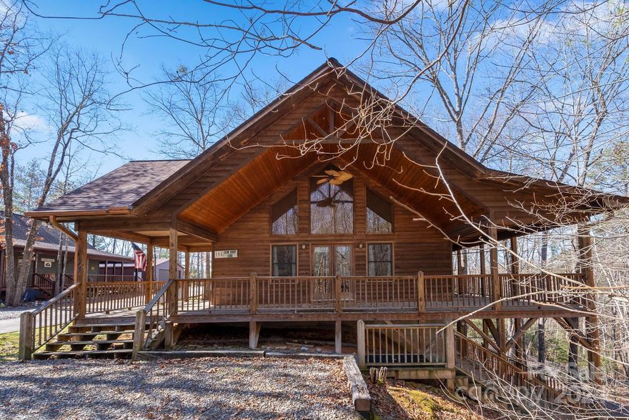 Welcome to your new home where every day feels like a staycation! Kick back and relax in this charming ranch-style house with high vaulted wood ceilings, tons of natural light, and more outdoor living space on the multi-level porches than you could imagine. The main level boasts an open Great Room, Master Suite, and guest bedroom with en suite for your convenience.

Head down to the fully finished lower level, and you'll discover a spacious additional living area, another guest bedroom, and bathroom. Step outside through the exterior entrance to the expansive lower level deck and a stairway leading to parking.

Conveniently located just a short drive from Downtown Murphy and less than a mile from Dukes Marina and Lake Hiwassee, this home is move-in ready and just waiting to be yours!