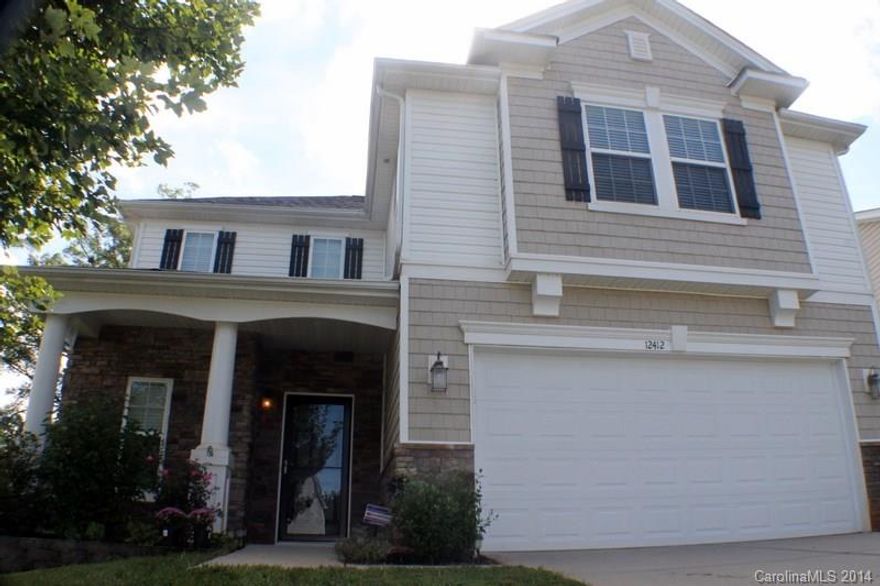 Move-in Ready! Only min to I-77 & 485, Carowinds & new Outlet Mall! Beautiful home w/fr porch & lg, fenced backyard. Stone accents give this 3 BR 2.5 BA home great curb appeal! Extended concrete patio overlooks a lg, peaceful, private-wooded backyard!! Home boast an open fl plan; LG kit, lots of cabinets & counter space, island, & eat-in area; open to LR w/corner FP; hardwoods on main. Spacious master ste w/LG walk-in closet, soaking tub w/sep shower and tile surround. A must see!!