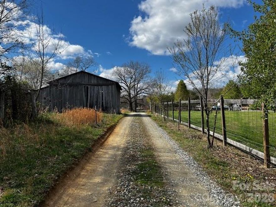 Some properties stop you in your tracks. This is one of them.

The views alone are worth the drive — but it’s the combination of gentle topography, usable land, and pure possibility that makes this offering truly rare. Whether you envision a boutique glamping retreat, a dog-friendly resort, a private estate, or something entirely your own, the canvas is here and ready.

Currently operating as a small RV campground, the infrastructure is already in place. The property features full RV hookups with power and septic, plus two separate septic systems offering flexibility for expansion. A charming bathhouse with laundry and a well-appointed park model provide immediate functionality, and both the park model and the impressive 30x50 pole barn are equipped with their own 200-amp electrical service.

The pole barn also has a dedicated septic system, making it primed for partial conversion into a studio apartment, expanded living space, workshop, or additional camper accommodations. The groundwork has been thoughtfully laid for growth. This is also suitable as an equestrian property!

The land itself is a pleasure to explore — mostly level, with a blend of open pasture and woods, plus established trails winding throughout. Mostly fenced with easy access, it’s as practical as it is beautiful.

Significant investment has been made in the landscaping, with Emerald Green arborvitae and magnolia trees enhancing privacy and creating a welcoming, polished feel across the property.

Opportunities with this level of infrastructure, flexibility, and natural beauty don’t come along often. Call today to schedule your private showing.