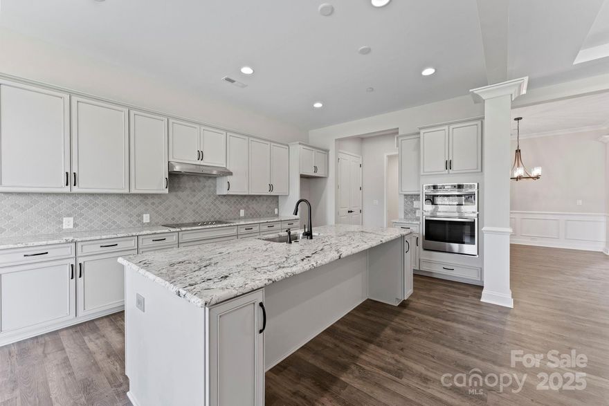 What's Special: Walkout Basement | 3 Beds on Main Floor | Wooded View.
New Construction - February Completion. Built by America's Most Trusted Homebuilder. Welcome to the Carlyle at 1055 Sugar Creek Road in Estates at Sugar Creek. This one-story ranch design with finished basement features a spacious great room with a cozy gas fireplace, a bright kitchen with casual dining, and a formal dining room with a tray ceiling near the entry. The primary suite includes a tray ceiling, spa shower, dual vanities, and a generous walk-in closet, while two additional bedrooms and a dedicated study provide space for work and relaxation. A finished basement adds a private bedroom and bath suite along with two versatile bonus rooms. River Falls is a stunning community in the highly sought-after Tega Cay area, close to Lake Wylie and scenic parks for endless outdoor activities, all with the benefit of lower South Carolina taxes, and with easy access to I-77, I-485, and SC-160, commuting to Fort Mill or Uptown Charlotte is a breeze. Additional highlights include: spa shower at primary bath, finished walkout basement with basement suite, tankless water heater, fireplace at great room, study with French doors, metal roof, 4' garage extension. Photos are for representative purposes only.