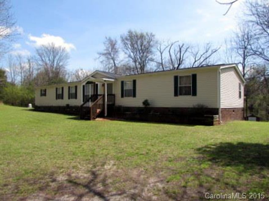 Great country and private living in Smyrna! Immaculate doublewide mobile home sitting on 5 acres neat as can be. The home offers split bedroom plan, 2 living areas, wood burning fireplace, walk in shower w/ seats, whirlpool tub w/ jet, open living/dining/kitchen which would be great for entertaining. All window treatments to convey, newer roof, disposal, exterior doors, HVAC and hot water heater. Enjoy outside in your large private backyard.