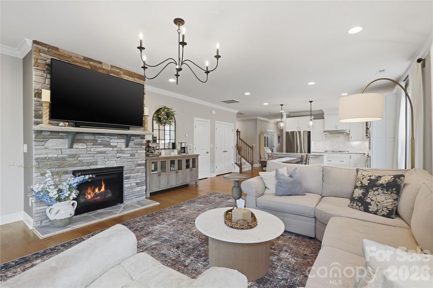 Stunning M/I Home Built in 2020 – A Rare Opportunity! This beautifully designed 1.5-story home offers the perfect blend of luxury, comfort, and thoughtful upgrades—ideal for downsizing, upsizing, or anyone seeking an elevated living experience. From the moment you step inside, light engineered hardwoods set an inviting tone and flow throughout most of the main level. The formal dining room is a true showpiece, featuring custom millwork, crown molding, window trim, and an exquisite ceiling detail that sets this home apart. The craftsmanship and millwork continue throughout the home, adding a refined touch of luxury.  The chef’s kitchen impresses with champagne-gold hardware, a stylish backsplash, under cabinet lighting, upgraded faucet, and a newly finished custom pantry and storage closet. The great room is warm and welcoming, highlighted by a gorgeous stone fireplace. The primary suite takes this home from exceptional to unforgettable. Enjoy custom wall molding, upgraded carpet, and a spa-inspired en-suite bathroom that feels straight out of a magazine. The zero-entry shower (ADA accessible) features champagne-gold fixtures and state-of-the-art shower equipment. Beautiful tilework, recessed storage cabinetry, and a meticulously designed custom closet complete this luxurious retreat. Upstairs, you’ll find a generous bonus room, a full bath, and a spacious additional bedroom—perfect for guests, hobbies, or a private workspace. All this comes with a private wooded backyard and added convenience the blinds in the kitchen, great room, and primary bedroom are app-controlled and can be programmed to raise and lower automatically throughout the day--can we say SHOWSTOPPER! Additional upgrades include enhanced garage storage and a new garage door opener installed in 2025. If you’ve been searching for a ranch or story-and-a-half home with true craftsmanship and standout details, this is the one. Schedule your showing today and experience this spectacular property in person