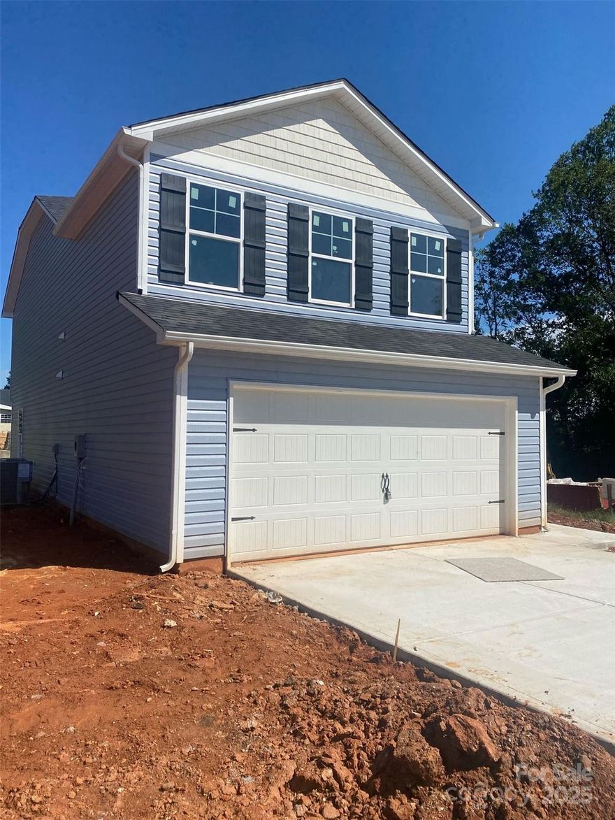 Beautiful 1,813 sq. ft. new construction home located in the quaint city of Kings Mountain. This home features 4 bedrooms, 2.5 bathrooms, and a 2-car garage. The kitchen includes a stainless-steel appliance package with flat-top range, OTR microwave, and dishwasher, as well as granite countertops and an open floorplan perfect for entertaining. The primary bedroom offers a vaulted ceiling, walk-in closet, and ensuite bathroom with a garden tub/shower combo, double vanity sinks, and a private water closet. Conveniently located close to main attractions, this home is a must see!