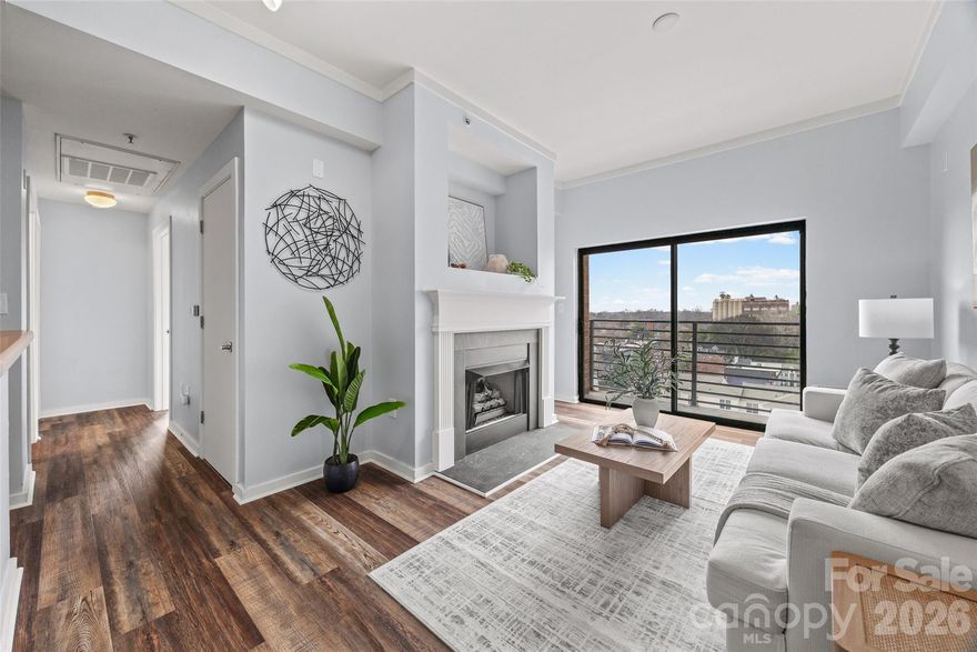 Located on the 7th floor corner of a beautiful Fourth Ward building, this two-bedroom, two-bathroom condo offers stunning year-round views of the Uptown skyline. The home features neutral paint tones, updated flooring, and plenty of natural light throughout.
The living room includes a gas fireplace and direct access to a private balcony overlooking the community pool. The kitchen is equipped with white cabinetry, stainless steel appliances—including a 2021 gas range and a 2024 dishwasher—and the refrigerator will remain. A convenient laundry closet contains a stackable washer and dryer (2022), which will remain.
The primary bedroom sits on the corner of the unit and features windows along two walls, a closet, and an ensuite bathroom with a shower. The secondary bedroom also enjoys Uptown views and is served by a hall bathroom that includes a large vanity and a tub/shower combination.
The secure building offers controlled key-fob access, a welcoming lobby, elevators, an outdoor pool (with new pool furniture arriving soon!), and a parking garage. This condo includes one assigned parking space. The unit is also just one flight of stairs or a quick elevator ride to the rooftop terrace, where residents can enjoy Uptown views or make use of the grilling station. The HOA recently installed a new roof.
Fourth Ward is known for its charming neighborhood parks, delicious restaurants, and lively seasonal festivals. The condo is located less than half a mile from the 9th Street light rail station and offers easy access to everything Uptown has to offer—including sporting events, nightlife, dining, and the arts.