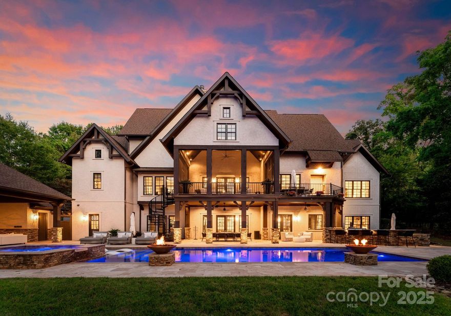 Stunning doesn’t begin to describe this breathtaking waterfront home, featured in multiple magazines for its exceptional design, luxurious finishes & attention to detail. The open floor plan is ideal for both everyday living & entertaining, offering seamless flow between indoor & outdoor spaces. The main level features a gourmet chef's kitchen open to the family room, a spacious primary suite & an exquisite executive home office. The lower level includes a theater room, billiards area & wine cellar w/designer touches throughout. Outside, enjoy a screened porch, covered porch, resort-style pool, hot tub & poolside cabana all overlooking beautiful waterfront views. Take a short walk down the boardwalk to semi-private dock shared w/only 3 other residences. Includes lift & jet ski pad. Add'l highlights include beautifully manicured landscaping & multiple outdoor living areas designed to capture the serene lakefront setting. This one-of-a-kind estate blends timeless elegance w/modern luxury