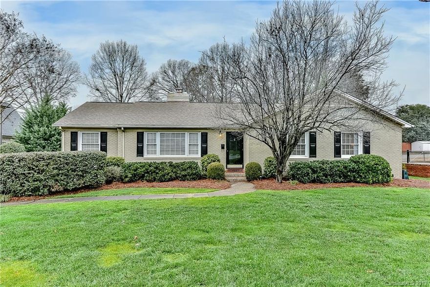 Adorable Olde Cotswold painted brick ranch is renovated top to bottom and move in ready; however it is also situated on a large .4 acre flat lot and has endless possibilities for expansion in this desirable neighborhood. Kitchen has granite countertops, stainless appliances and white cabinetry. Opens to family room and a great sunroom. Beautifully renovated bathrooms. Deck overlooks fenced backyard. Eastover, AG, Myers Park. Walking distance to Cotswold Shopping Center!