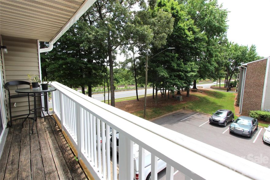 Amazing 2 BR, 2 Full Bathroom on level 3. Currently leased for $1,150 per month & lease terminates at the end of April this year.  Open floor plan with great line of sight with connected kitchen / living room & quick access to laundry room. New oak cabinets, new modern back splash and lighting fixtures. Spacious living room is bright with sliding glass doors to covered patio. Primary bedroom has attached bathroom, ceiling fan and is approx. 14 X 11 in size.  Refrigerator included. Great location close to UNCC, less than a mile to the light rail, quick access to I-485, restaurants & shopping.  HOA dues are $199 per month. No HOA rental cap, short term rentals under 6 months are not allowed. Complex does not qualify for FHA financing. If conventional loan, we suggest buyer confirm with lender as they may or may not meet Fannie Mae/ Freddie Mac requirements. Please contact HOA for all the details. There is now a security camera at the entrance to this building.