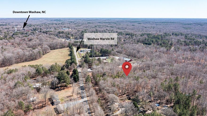 Consists of  2 parcels Approximately 100' wide total near downtown Waxhaw.  Perfect for future developement under the R4 zoning (ex. cottages, duplexes, religious institutions, gov't offices and/or bed & breakfast) regulations for City of Waxhaw. Also located on the Waxhaw Corridor road widening project.  The WC project will have setback requirements for developement.  Public water and sewer not currently available at this location. 24" county water main & hydrants exist at street and city sidewalks.  There was a former residence on 1 parcel so an old well & septic may exist.  Lot is fronted by Waxhaw Marvin Road & to the rear CSX RR right of way.  Lot size is approximately 114 wide per Union Co records.  This is 1 of 4 adjacent lots available in the town of Waxhaw.