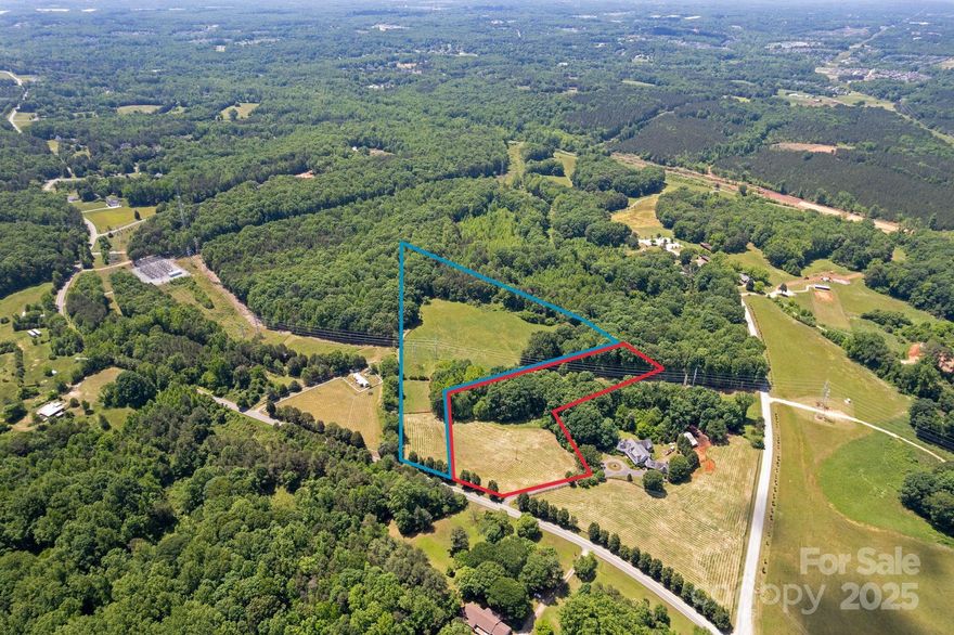 Discover the perfect canvas for your dream home on this breathtaking 10.03-acre estate lot, ideally located just minutes from the heart of historic downtown Davidson. Lot 3 offers a rare opportunity to own a private, picturesque property that seamlessly blends natural beauty with unmatched convenience. Tucked beside the expansive 200-acre Fisher Farm Park, this is a one-of-a-kind parcel. With ample space to accommodate a custom-built estate, this lot is perfect for those seeking a refined rural lifestyle with the option to bring your vision to life. Whether you're looking to create a timeless country retreat or a modern farmhouse masterpiece, this property offers the flexibility and inspiration to build something truly special.