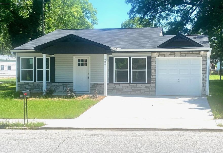 Welcome to this newly constructed home located on a quiet street in Gaffney in close proximity to schools, restaurants and shopping. A few minutes from Limestone college. Short distance to major highway I-85. This home is perfect for a first-time home buyer, one looking to downsize, or an investment property. Home has an alley way in the back perfect for extra parking or pulling a camper or boat on the property! As you step inside this quaint 3 bedroom 2 bath you will be captivated by the intricate attention to detail in this 1,100 sq ft home. The builder has spared no detail when completing this home! The concept is an open layout with a spacious island, tile backsplash, plenty of cabinets and sunlight coming through in the kitchen and living room. All of the closets come with custom shelving. Luxury laminate flooring throughout the home. Custom shelving in master bath with walk in shower that is perfect for the elderly. Don't miss out on this great priced opportunity!