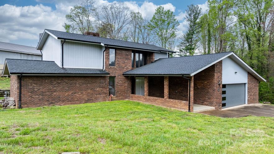 Unique Tri-Level home in the Heart of Hudson!! 3 Bedroom, 3.5 baths. A rare find with 2.54 ACRES just off of Hwy 321 yet NO CITY TAXES!! LARGE detached multi-purpose building which would be great for car storage or hobby. Once you enter the home, a large foyer with a HUGE brick fireplace welcomes you. Newly refinished wood parquet floors. The towering, beamed ceilings and 2-story fireplace are featured in the living area. Lots of windows offer tons of natural lighting. Large sunroom with brick flooring.  Spacious kitchen with lots of cabinetry with island, bar area and breakfast nook.  Formal dining room. Main level primary bedroom with large garden tub and walk-in closet.  This room also has access doors that lead to a patio. Upstairs you will find two well appointed bedrooms split by a large foyer area. Each bedroom has their own en suite full bathroom and one of them leads to a second story deck!! Schedule your appointment today!!