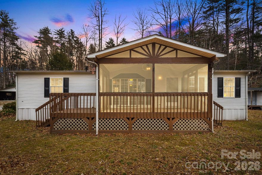 Nestled in a beautiful, wooded setting just minutes from downtown Brevard, 106 Avian Court offers comfortable mountain living with convenient access to local shops, dining, and outdoor recreation. The main living area features newer flooring, a cozy gas fireplace with stone surround (Log insert needed), and an open layout connecting the living, dining, and kitchen spaces.

The kitchen provides ample cabinetry and workspace, while natural light throughout the home creates a warm and inviting atmosphere. The primary suite includes an ensuite bath with a soaking tub and generous vanity space. Additional bedrooms offer flexibility for guests, office space, or hobbies.

Outdoor enjoyment is enhanced by a spacious deck overlooking the surrounding trees and winter views, ideal for relaxing or entertaining. The lot is over three acres with a potential building site behind the home. This additional site has potential for excellent views with the possibility of being subdivided (county approval required) A covered carport provides convenient parking and storage. This well-maintained property offers a blend of privacy, functionality, and proximity to all that Brevard and Western North Carolina have to offer.