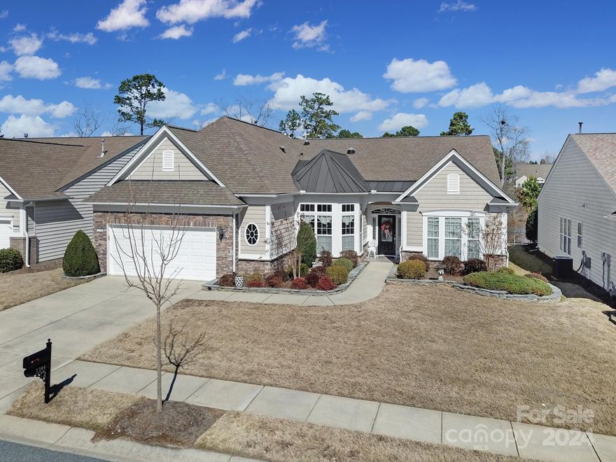 Enjoy outdoor living in this lake view Cumberland Hall w/ a 3-season room & large paver patio! This home sits on a premier lot with expansive views of the lake! Upgrades include a 3-season room w/ EZE-Breeze windows, solar tubes in the kitchen & drop zone, cherry wood floors in the bedrooms, great room, dining area, & office, crown molding, solar attic fans, & a golf cart outlet in the garage! Kitchen features cherry cabinets, granite counters, SS appliances, an electric cooktop, wall oven & microwave, large island, & a pantry. Cozy up to the gas fireplace in the great room during the winter months, and eat meals at the bar, bkfst nook, or dining area! The primary suite has a tray ceiling & a bathroom w/ a soaking tub, dual sink vanity, & a glass shower! The Jack-and-Jill bathroom connects the 2 guest bedrooms, one of which has built-in shelving! The office sits at the front of the home & has 2 French doors. Come see this home for yourself, today!