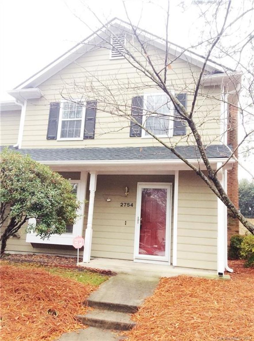 Gorgeous two bedroom, two bath, corner townhome in the Hamlin Park Community.  Open Living area, with built in bookcases and wood burning fireplace.  Hardwood flooring throughout most of the floor plan.  Stainless steel appliances in kitchen and newly tiled counter tops, with an abundance of cabinetry and over sized windows with bench seat in the breadfast area.  Newly remodeled half bath and main bath on second level.