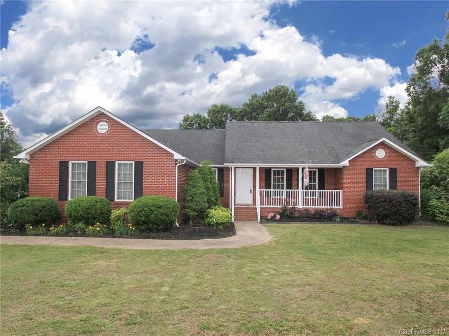 Back on the market! Buyer's financing fell through. Very well maintained brick ranch with a great floor plan. Freshly painted. Home offers open living room to kitchen and dining, spacious master with luxury bath, large laundry room with built-in cabinetry and so much more. Enjoy your evenings on your large corner lot either on the rocking chair front porch or cook out on the spacious deck. This is one you don't want to miss!!!