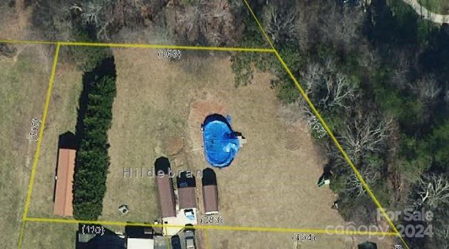 New listing; hard to find nearly level lot with city water & sewer available. Paved street and easy access to Hickory.