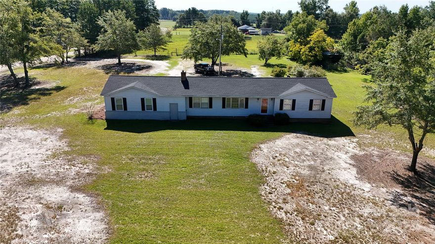 WHAT A RARE FIND!! This 3 bedroom 1 full bath home is situated on 8.73 acres of partially open and partially wooded land and perfect for your small family farm. Bring your horses and other animals, with the majority of the property being fenced. The dwelling is perfect for your family with a large yard and 2 car enclosed carport, which could be turned into an enclosed garage with the addition of garage doors. The home has a 4 year architectural shingle roof, large brick fireplace in the den area, dining room and living room which could be used as a fourth bedroom. Come and see what this property has to offer!!