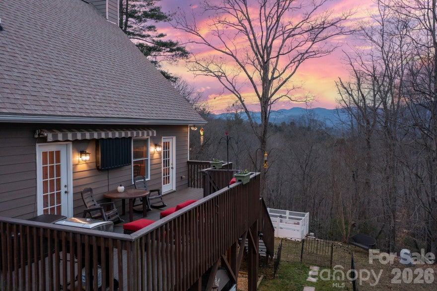 Charming mountain retreat 20 minutes from downtown Asheville, nestled on 4.66 beautiful acres. This adorable 3-bedroom, 2-bath cabin offers the perfect blend of privacy, comfort, and breathtaking mountain views. Enjoy peaceful mornings on the porch overlooking mountain views and evenings surrounded by nature. The spacious acreage provides room to garden, explore, or simply relax and take in the fresh mountain air. Conveniently located just a short drive to local amenities, dining, and shopping, this property offers the best of both worlds—seclusion without sacrificing accessibility. The main level features an open floor plan, a primary bedroom with an ensuite bath, and a vaulted-ceiling living room with a wood-burning stove. Upper-level loft features a large guest bedroom with a tongue-and-groove ceiling. The lower level includes another guest bedroom with an ensuite bathroom, a family room, and a gas fireplace. Exterior garden space and 2 large studio workshops wired with electricity, insulated with a loft for all your hobby needs. Whether you're searching for a cozy vacation getaway, a short-term rental opportunity, or a full-time homestead, this sweet mountain cabin is ready to welcome you home. This property is located in Buncombe County, Marshall. The proposed new Publix in Leicester is just a 10-mile drive. The property would make a great STR with most of the furniture included. Don't miss this rare opportunity to own your own slice of paradise!. Peace, privacy, and panoramic beauty await—all just a scenic drive from quaint Marshall and Asheville.