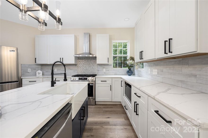 Welcome to 402 Sardis N — a beautifully re-envisioned 5-bedroom home where designer style meets everyday comfort. Thoughtfully renovated from top to bottom, this residence delivers modern living at its finest with open-concept spaces, intentional upgrades, and room for everyone.

The heart of the home is the magazine-worthy chef’s kitchen, featuring custom cabinetry, premium appliances, and a statement island that brings everyone together. Light-filled dining and living areas flow effortlessly for entertaining and daily living, creating a warm yet elevated atmosphere.

A walk-out lower level expands the way you live — ideal for a media room, gym, play space, or private guest quarters. Upstairs, the primary suite feels like a retreat with spa-inspired finishes and incredible privacy. Generously sized secondary bedrooms offer flexibility for family, office space, or guests.

Step outside to your fenced backyard oasis with an oversized deck designed for gatherings, quiet mornings, and easy outdoor living.

Located in a top-rated school district and just minutes to SouthPark, Cotswold and Uptown Charlotte dining, shopping, parks, and conveniences — this home offers the best of style, space, and location.

Modern luxury. Thoughtful design. A place you’ll love coming home to.