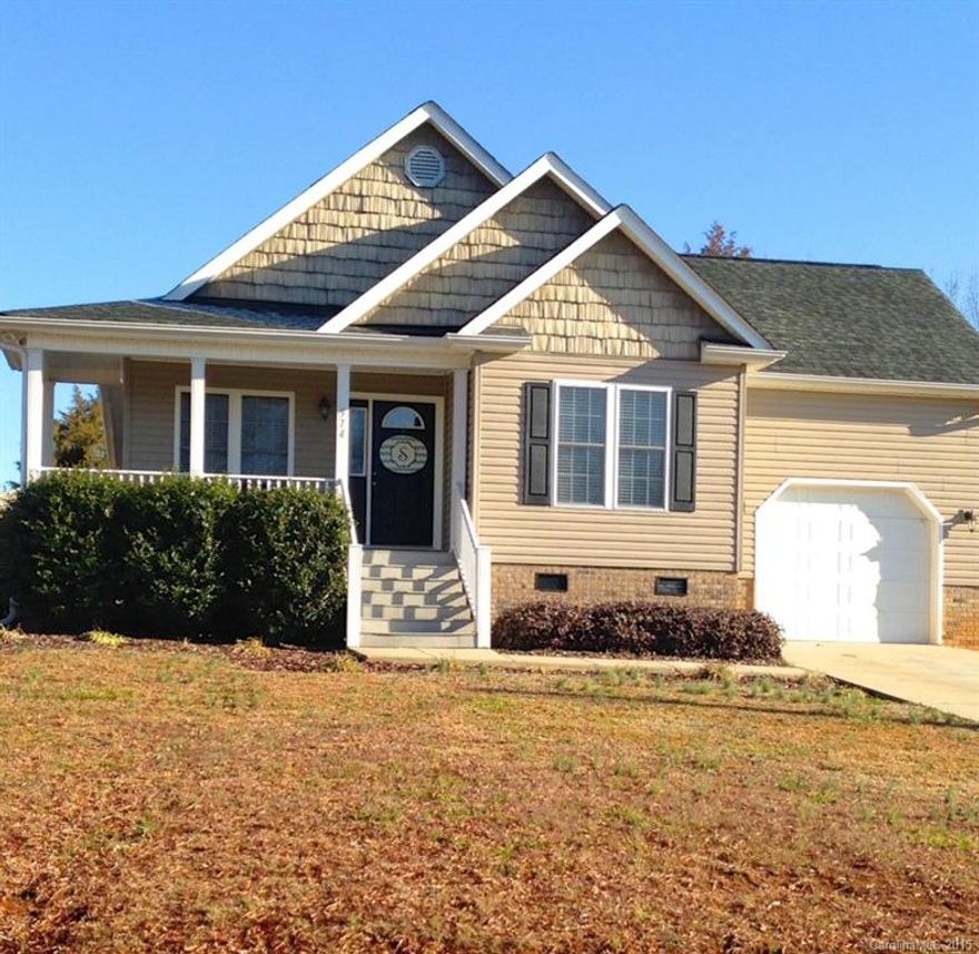 This attractive design is located in the desirable Tranquil Bay area of Norwood just across the street from Lake Tillery. upgrades include carpet and paint. The custom tile work in the kitchen and hardwood floors in the den and dinning room add to the charm. Enjoy the close proximity to the Lake, area golf, schools and shopping.