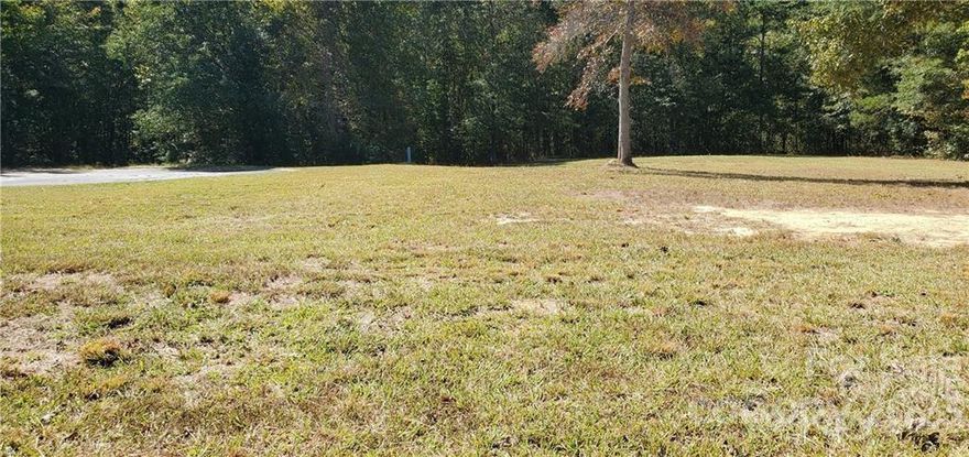 Level building lot that is already cleared, taps added and ready to be built on. Providence Crossings is a nice place to call home. Great lot for your new custom-built home. 1.42 acres cleared lot on cul-de-sac with water and sewer taps included. East access to Bypass 9 and the Charlotte Highway.