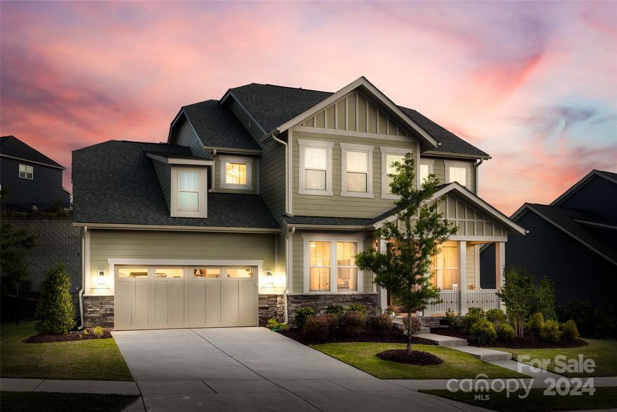 Better than new, this Masons Bend Fielding home is seeping w/ charm! A relaxing front porch greets you as you make your way in on hardwood floors that run throughout the main, even into the upstairs loft. The chef's kitchen is sure to impress w/ SS hood, gas range, SS apron sink, butlers pantry, walk-in pantry w/ solid shelving, & generous island. The great room is centered by a gas fireplace, & off the dining area is a covered porch w/ composite deck & cozy stacked stone fireplace overlooking the fenced yard. Downstairs you'll find other features incl office w/ french doors, built-in drop zone, & updated 1/2 bath. The primary suite is expansive & boasts a tray ceiling & walk-in tiled shower w/ bench. Another 3 beds & 2 baths round out the upstairs, as well as loft & laundry w/ sink, counters, & cabinets throughout. See attached list for all the added features! Masons Bend resort style amenities incl Catawba River launch, pool, fitness center, elem school on site, &more - welcome home!