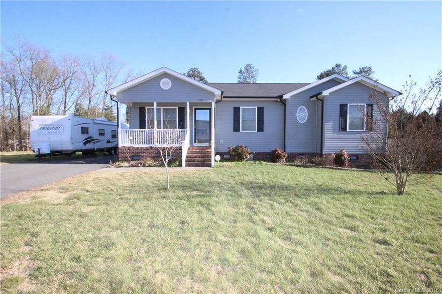 Move in ready 3 bedroom / 2 Full Baths!  This home has fresh interior paint and freshly cleaned carpets.  Spacious bedrooms.  Huge master suite with a walk in closet, huge master bath with a garden tub and dual vanity sinks. Covered rocking chair front porch.  Huge deck for entertaining.  Fenced in backyard.  Huge 12x29 wired outbuilding with lots of storage. Extra wide driveway for parking plenty of vehicles.