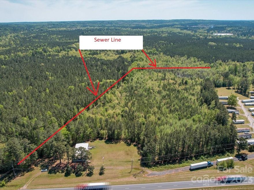 WOW is all you can say about this listing! 18.93 +/- acres of land located on HWY 74 in growing Anson County!!!
Land has sewer on the back and side of the property. Great visibility from HWY 74. The building was formally used by Woodman of the World and offers 3,252 sf footage. Floor plan includes a huge conference room, two bathrooms, sitting room, storage and a kitchen. Location, topography and size are all assets to this listing.