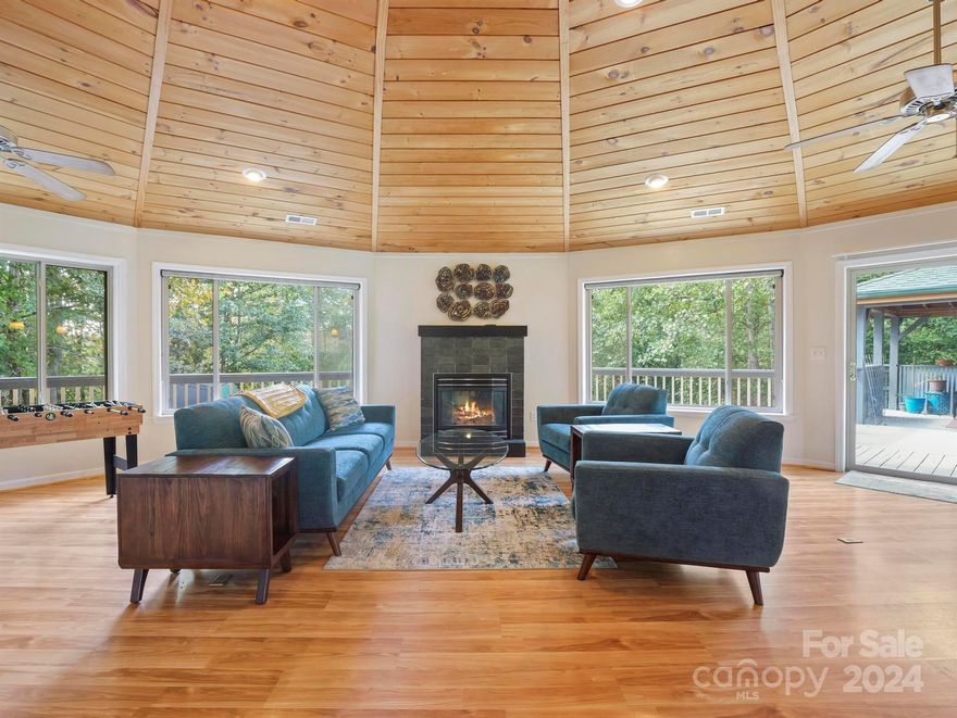 This custom Deltec home was created with a high performance design to connect you with nature. The quality of craftsmanship and attention to detail is captivating. The round shapes offer panoramic views, bringing the outdoors in. This floorplan was designed to maximize energy efficiency and functionality. The home has 3 phases including the original phase, second phase & lower level apartment with separate entry - all of which have their own HVAC system - and come FULLY FURNISHED. Lower apartment has additional laundry & kitchen area. The primary bedroom offers a private balcony overlooking the backyard garden area, along with walk-in closet & ensuite bathroom. Other features include granite kitchen countertops, custom cabinetry, walk-in pantry, built-ins, tongue & groove ceilings, gas fireplace, outdoor fire pit, fenced raised garden beds and a soothing water feature at the entrance. * Sweetbriar Farms is a private/gated community that offers a park/gathering area on the Northside. *