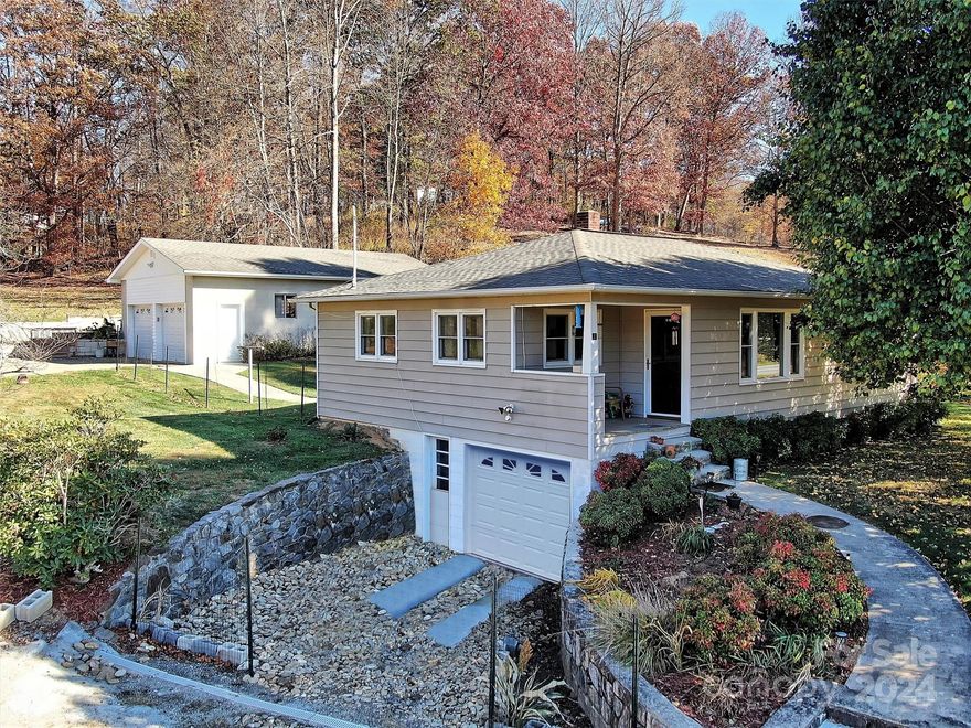 Views, location and room to garden! Quaint Canton Charmer with mountain and big sky views nestled in the Blue Ridge Smoky Mountains. This traditional home sits on .74 of a green nearly flat acre and provides the feel of easier times. Step into the cozy living room enhanced by the warm fireplace. This home would be great for first time home buyers, long/short term rental or your mountain getaway. The bonus of an oversized 2 car garage building with water, power, tandem parking and an attic for storage opens the door to many opportunities for use. Take a look today!