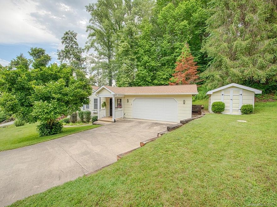 Location, location, location. This charming, one-level home is conveniently located yet still offers privacy. Beautifully landscaped, double garage, outbuilding, fireplace, walk-in closet in master. Must see!