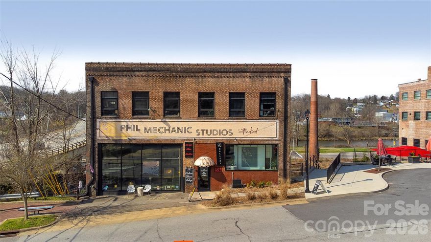 Phil Mechanic Studios offers a rare opportunity to acquire a historic creative workspace
building in Asheville’s River Arts District. Located at 109 Roberts Street and spanning more than
20,800 square feet across five floors, the property serves as a long-standing anchor for the
district’s arts community. Home to more than 35 artists and creative businesses, the building
benefits from strong demand driven by Asheville’s nationally recognized arts and tourism
economy. Positioned adjacent to The Radical Hotel and within one of the city’s most active
redevelopment corridors, the property offers a distinctive investment within one of the
Southeast’s most vibrant creative districts. Located in between The Radical Hotel and The Wedge Studio's.  The sale includes the parking lot across the street on the corner.