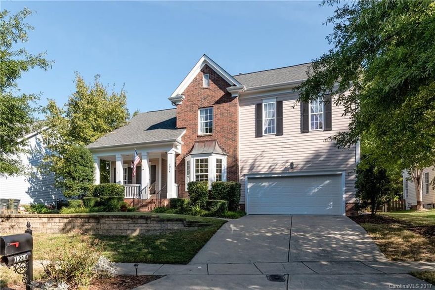 Charming Lakeshore Beauty on the Tega Cay peninsula. Welcoming front porch. 2 sty foyer. Formal DR & LR (or ofc). 2 sty GR w/fpl, open to k'chen w/granite, bkft bay & eat at bar. Laundry Rm. MBR on Main w/hdwds & lux BA. 3 BRs up, one MBR size. Lrg Bonus Rm. 2 attic for fabulous storage. Relaxing screen porch. Entertaining yd/paver patio. Built-in gar storage. Award winning Fort Mill Schools. Wonderful TC amenities i.e. n'hood prks, trls, beaches, pool, golf & lake access. No HOA. Low SC taxes.