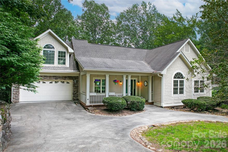 Welcome home to effortless main-level living in the highly sought-after gated community of Connestee Falls. 
This beautifully maintained 3-bedroom, 2-bath home offers easy access with a flat circular driveway and a thoughtfully designed open, split floor plan. Inside, you’ll find soaring vaulted ceilings throughout, creating a bright and spacious feel. The main living areas feature hardwood floors, while all bedrooms have been updated with brand-new carpet for added comfort. The entire home has just been freshly painted—including ceilings, trim, doors, and the garage—providing a clean, move-in-ready experience. The kitchen is both functional and inviting, featuring stainless steel appliances, granite countertops, a breakfast bar, and a dining area. A separate formal dining room adds flexibility for entertaining.  Above the garage, you’ll discover a huge bonus room (over 500 square feet) with vaulted ceilings—perfect for a home office, media room, or guest space. Relax and enjoy the outdoors year-round in the 3-season sunroom, or expand your living space even further with the unfinished lower level, which offers the potential to add over 1,500 square feet.  Major exterior maintenance has already been completed following a home inspection, including new siding in select areas and fresh exterior paint—giving you peace of mind. Connestee Falls offers an exceptional mountain lifestyle with abundant natural amenities, making it a truly special place to call home. Community Note: A one-time User Amenity Fee of $16,000 applies to new buyers, billed December 31st in the year of purchase and due January 31st. Buyers have the option to prepay a discounted fee of $14,000 at closing.