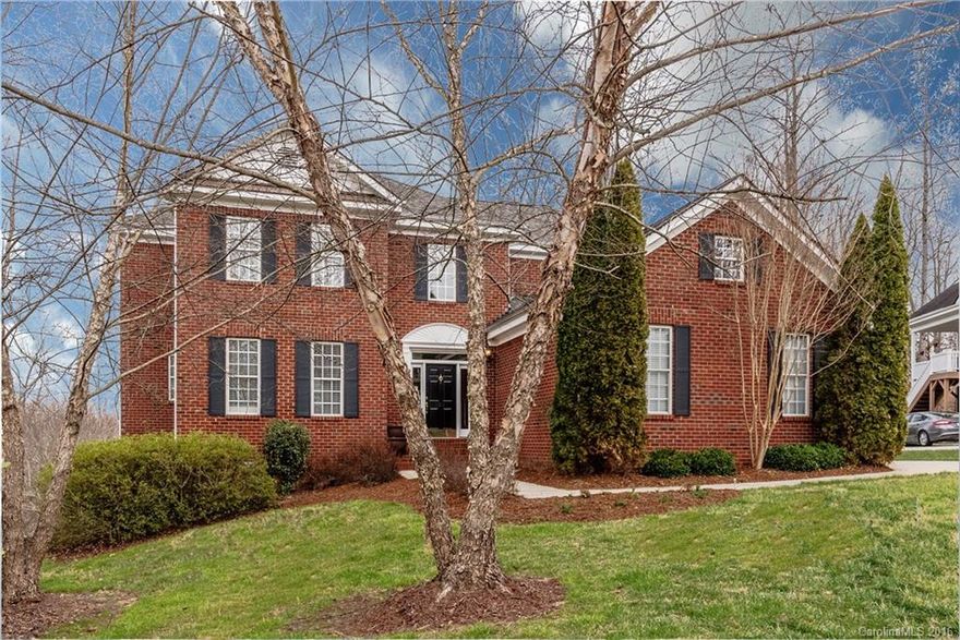 Excellent value for this full brick 4BR, 4 1/2 BT basement home w./highly rated schools & a quiet cul-de-sac location. Kitchen is open to FR w/a gas log frpl & stunning views of woods in rear of property. Stainlesss kitchen appliances include double ovens & Viking professional gas cooktop, granite & pretty tile backsplash. Professionally engineered retaining wall creates level play area.  Sloped lot leads to beautiful views of private wooded setting from elevated deck and rear of special propty.