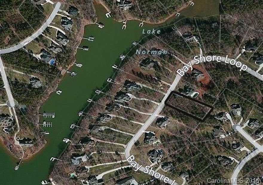 Nice wooded .71 Lake Norman water view lot in established waterfront community of 103 lots. Bring your own builder & build your dream home. No time-frame to build. Homes range from $400,000 - $1,300,000 off-water & up to $2 mil waterfront. Architectural restrictions & minimum square footage apply. Walking distance from Stumpy Creek Park & public boat access. Community offers street lights, curb & gutter roadways. Adjacent lot for sale MLS#3068800.