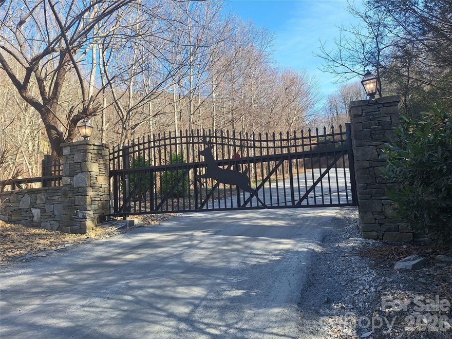 Welcome to 946 Lake Road in Old Fort, NC—your opportunity to own a piece of mountain living in the highly sought-after private gated community, Gateway Mountain, this property offers both security and access to an impressive range of amenities designed for outdoor enjoyment and relaxation.

Residents enjoy scenic hiking trails, the peaceful waters of Lake George, and inviting picnic areas perfect for gathering with friends and family. Whether you're looking for a full-time residence, vacation retreat, or investment property, this location delivers the ideal balance of privacy and recreation.

This land is a must see! There is a stream as you walk past the two boulders. If you walk the land, you will notice that there are two stone structures that appear to be a remanence of an old home. There appears to be multiple potential building sites. The parcel has underground electricity hookups. This lot features 450ft of paved road frontage. 

Surrounded by the natural beauty of Western North Carolina, this property provides a serene setting while still being conveniently located to nearby towns and attractions. Experience mountain living with community perks that make every day feel like a getaway.