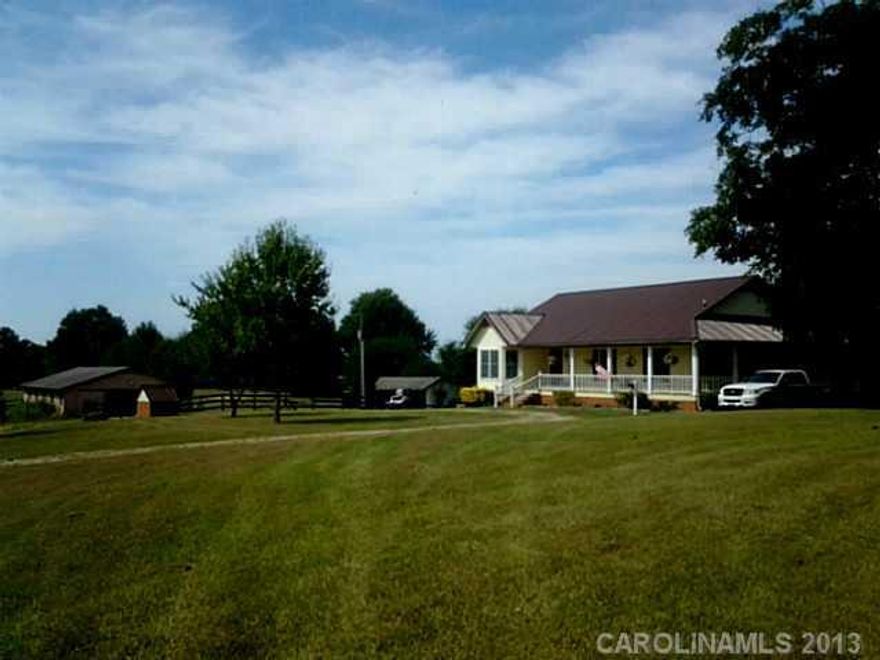 Bring your horses! This Heart of the Carolinas property has a 9 stall center aisle barn with tack room, separate  equipment shed, a large grass and sand arena  and hay storage.  15 additional acres are available.  The property is located two miles from a premier  equestrian event facility, Southern 8ths's Farm, and other training facilities. The house has a new roof and shows well. .Low taxes!