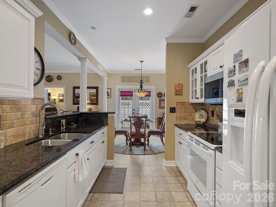 Meticulously maintained 2-bedroom, 2 full-bath patio home with a 2-car garage, located in the highly desirable, The Glen at Highland Creek. Superb location just minutes from I-485 and I-77, with easy access to restaurants, grocery stores, and everyday conveniences. This inviting home features a spacious open-concept living area with a gas fireplace, vaulted ceilings, and plantation shutters throughout. The updated kitchen offers granite countertops, tile flooring, a stylish backsplash, and all appliances convey. The primary bedroom includes a private ensuite bath and generous closet space. A large 2-car garage features an insulated garage door, recently replaced in 2025. As a bright corner unit, the home is filled with natural light. Outdoors, enjoy a private fenced patio—perfect for relaxing or entertaining while enjoying the peaceful surroundings. Special assessment to replenish HOA reserves, paid by Seller. Private roads maintained by HOA. Water/Sewer, exterior lawn maintenance, termite ,trash included in HOA. Contact Community Assoc Management with any questions.