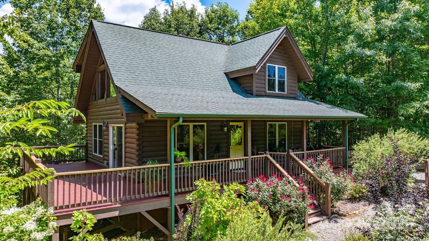 MOTIVATED SELLER, MAJOR PRICE IMPROVEMENT! Charming log cabin positioned on a spacious corner lot, features a large covered front porch & wrap-around side deck—ideal for relaxing or entertaining. A wooden fence encloses the front yard, landscaped with trees & flowering plants enhancing privacy & curb appeal. Step inside to cathedral ceilings that add a sense of rustic spaciousness. The main level offers open living room, dining area, kitchen, laundry closet, plus a full bath and bedroom. The upstairs primary suite includes an ensuite bath, a generous walk-in closet, & large loft area, creating a true retreat. Enjoy convenient access to community amenities—just 300 feet to a hiking trail and half a mile to the private lake with a walk-in beach, swimming dock, and pavilion with outdoor kitchen and natural stone fireplace. Grandview Peaks offers peaceful mountain living just 10 miles from I-40 for easy commuting and travel. see virtual tour for high resolution & more pictures. Home is being sold fully furnished!