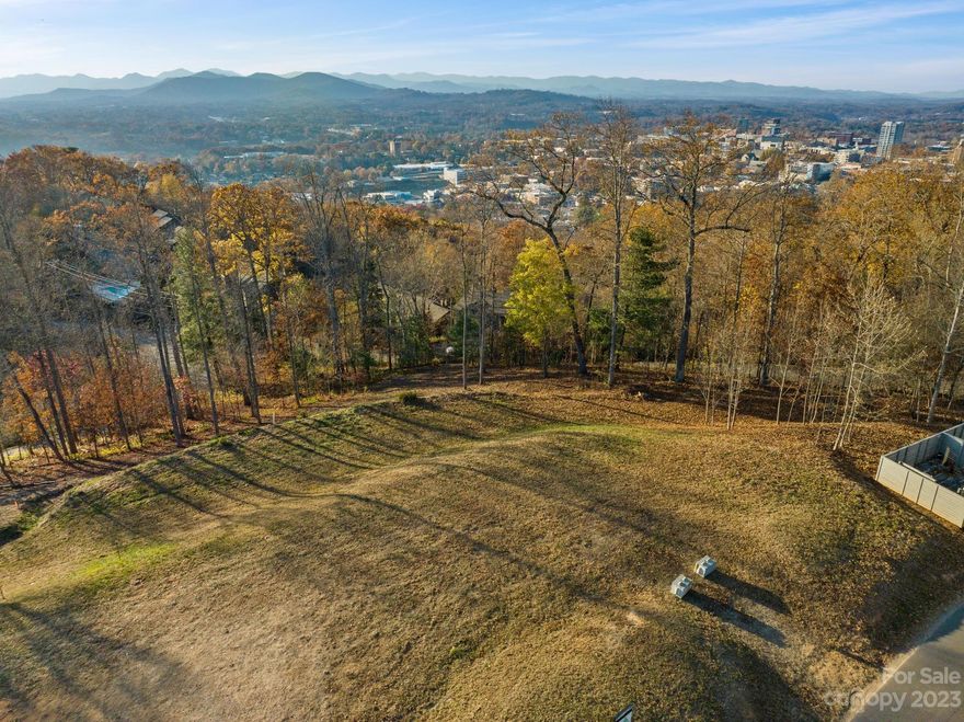 Convenient to all amenities, this extraordinary, level, 0.804 acre mountain-view home-site is located in the heart of the City of Asheville. Situated atop Beaucatcher Mountain, this jewel location presents a rare opportunity for the discerning buyer to build a beautiful custom home and enjoy spectacular sunsets and sweeping mountain views. Downtown Asheville to the northwest, sunrises to the east, with a protected forested greenspace that provides privacy and natural beauty! Scenic views with unbelievable proximity to the restaurants and all that Asheville and surrounding area offers - mere minutes from downtown, Biltmore Village, Mission Hospital and the Blue Ridge Parkway. Become part of Beaucatcher Knoll - modern in architectural style and fine craftsmanship - 424 Reservoir Road is truly mountain living at its finest! All underground utilities including electric, water/sewer, natural gas and fiber available and ready for build!