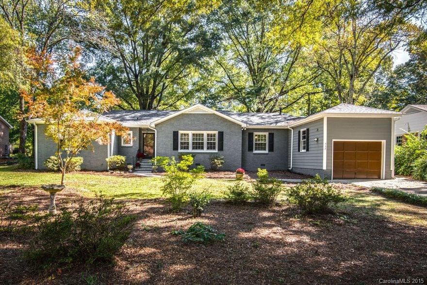 Sherwood Forest brick ranch on a wonderful lot. Everything you've been looking for.  Hardwood and ceramic tile floors, a garage, fenced yard and so much more. 
You'll love the large living room with a fireplace, updated kitchen with granite countertops and  stainless steel appliances, huge sunroom, both bathrooms have new tile and fixtures, fresh interior and exterior paint.  Lots of updates. A must see!