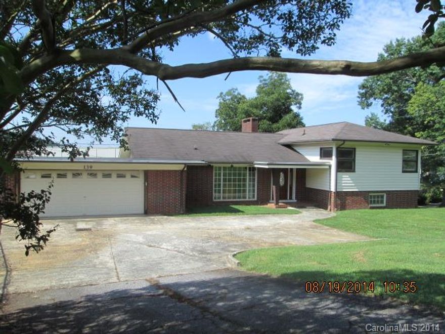 THE MOST HOUSE FOR THE MONEY ON LAKE HICKORY! Conveniently located just off of Hwy 127 behind Lakeside Marina. This 3000 SF+ waterfront home offers an open floor plan great for entertaining. Main level features a great room, dining & kitchen all w/water views, laundry & 2 car garage. The upstairs has the waterfront MBR, MBA & spacious closets & another BR & full BA. The lower level has a den w/FP that opens to a covered patio, wet bar, bedroom, full bath & storage/workshop. Swimming pool, too.