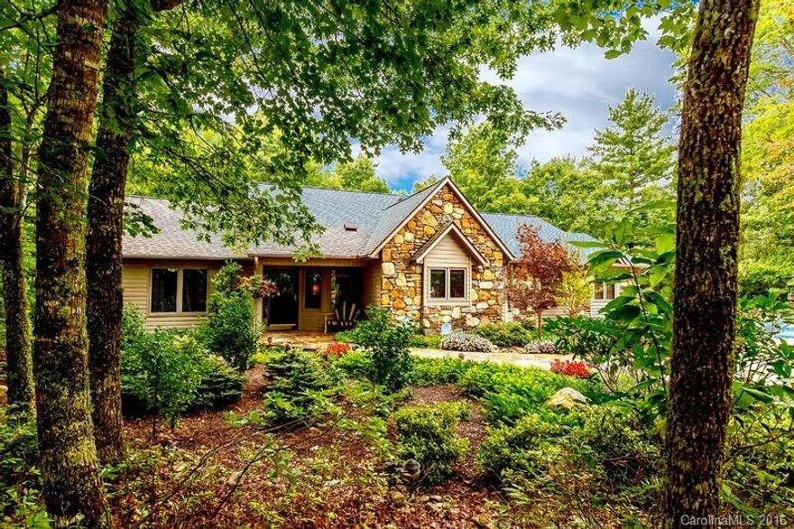 Enter this one of a kind custom home through a circular stone wall driveway featuring LG. great room, hardwood floors, vaulted ceilings, custom trim package, granite, formal dinning, eat in kitchen, owners quarters overlooking golf course, separate guest quarters, lower level media room, full bath private patio, fully equipped wine cellar.Come See Why We Love living Where We Play.