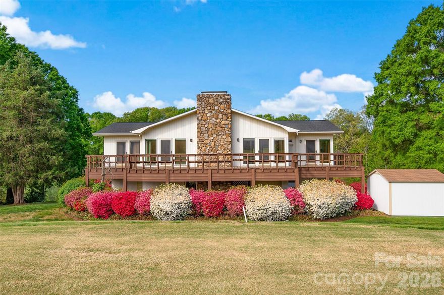 Contemporary-style home offering a unique blend of character, natural light, and scenic golf course from the back deck and pond views from the front deck. The open living spaces are highlighted by warm wood ceilings and expansive windows that bring in abundant natural light and showcase the surrounding landscape. The kitchen and living areas provide a functional layout for everyday living and entertaining. The spacious layout flows seamlessly to a large wraparound deck, ideal for enjoying those views! On this level, is also the primary with an updated en-suite bath and an additional updated bath on this level provides comfort and flexibility. The lower level offers extra space that is perfect for privacy including a recreation room,  two bedroom, full bath w/ shower-tub combo and 2 car garage with room for golf cart, workshop potential, or ample storage. The well landscaped exterior with mature plantings enhances the setting-- a rare opportunity combining modern design elements with a tranquil, view-filled environment. Truly one of a kind.