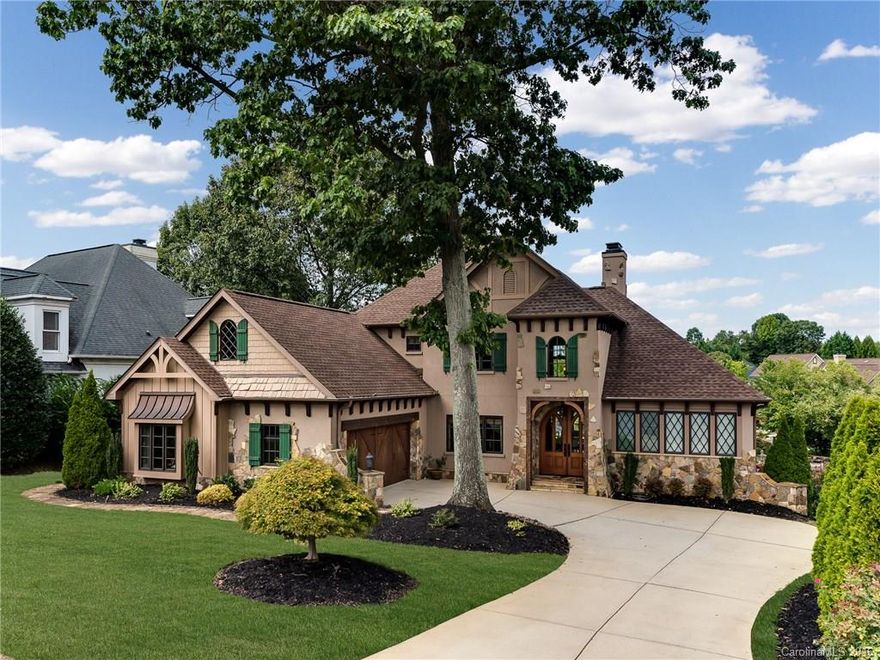 Walk across the street to The Peninsula Club from this remodeled waterfront French country home featuring cedar beams, corbels & stone. Sprawling views of Lake Norman; kitchen “with a view” has granite, stainless & gas. Mstr suite w/fireplace boasts new bath w/seamless shower, marble counters & floors, free standing tub. Lake level 2nd living qtrs, has family rm w/stone fireplace, full kitchen, bedroom & bath. Shared beach, boatslip w/6000 lb lift. Roof, windows, doors & HVAC recently replaced.