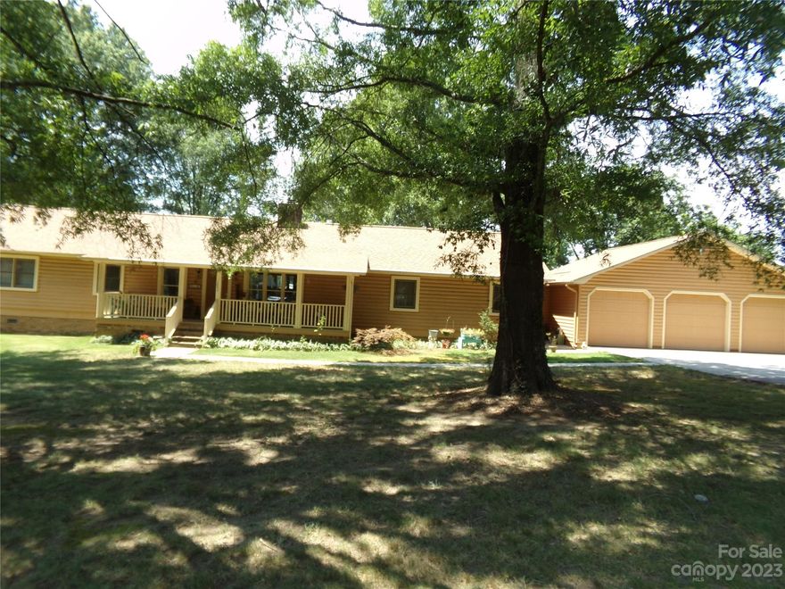LOOKING FOR A BEAUTIFUL PLACE TO CALL HOME -  Make the appointment today to come look at this home.  Kitchen, breakfast area, dinning area and great room - all one large room with fireplace.  Kitchen renovated with island gas cook top, built-in oven and microwave, granite counter tops and much more.    Glass doors lead to the open deck on back of the house.  Open Front porch complete with swing.  3 car garage with concrete drive.  Lots of storage area in the garage and breezeway between garage and side kitchen door.  3 bedrooms and 2 baths complete this well maintained home all located on 1.26 acres.   No HOA's.  Plenty of room in back of house for garden, etc.  Pecan trees   Come see much more to offer.   Only minutes from shopping, food, groceries in the fast  growing city of Locust.  Approx. 13 miles from I-485 in Charlotte.  Must see to appreciate the value.   Thank you for your interest and offer.