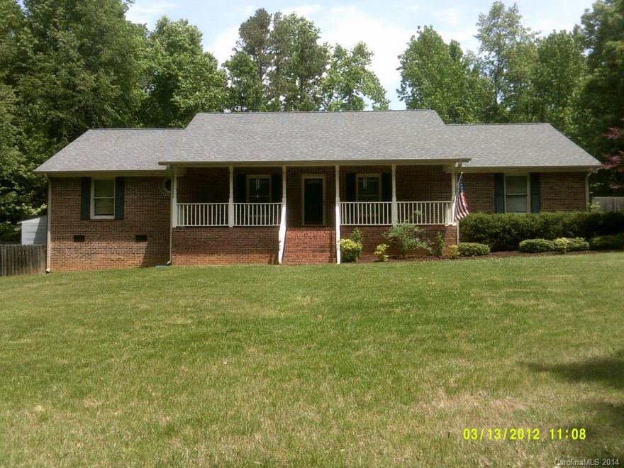 Great brick ranch with country front porch, hardfwood floors, masonry fireplace in great room, cedar lined walk-in master closet, formal DR, bay window, privacy fenced back yard. 2 lots with this home total 2 acres (Parcel #122377 & 122379)